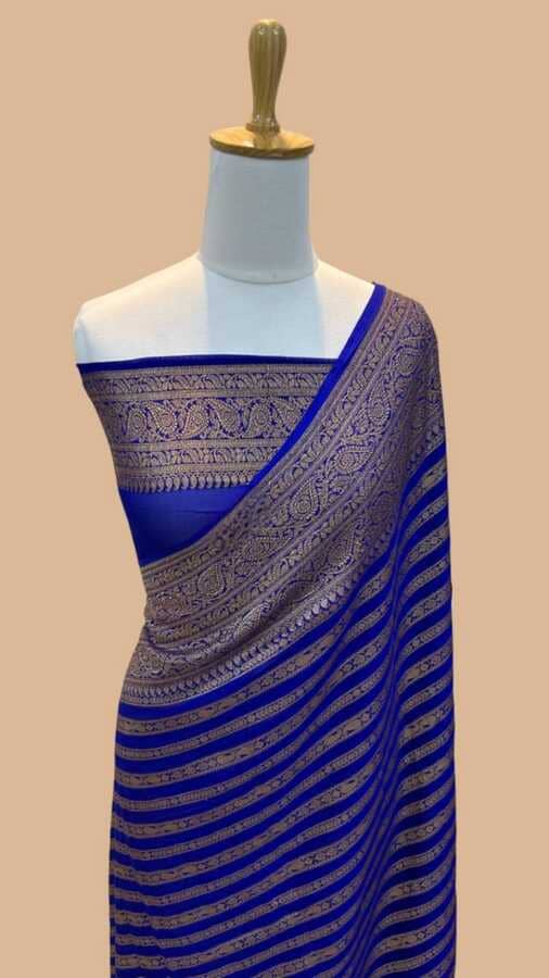 Royal blue warm silk Banarasi saree with ornate zari border and striped pallu