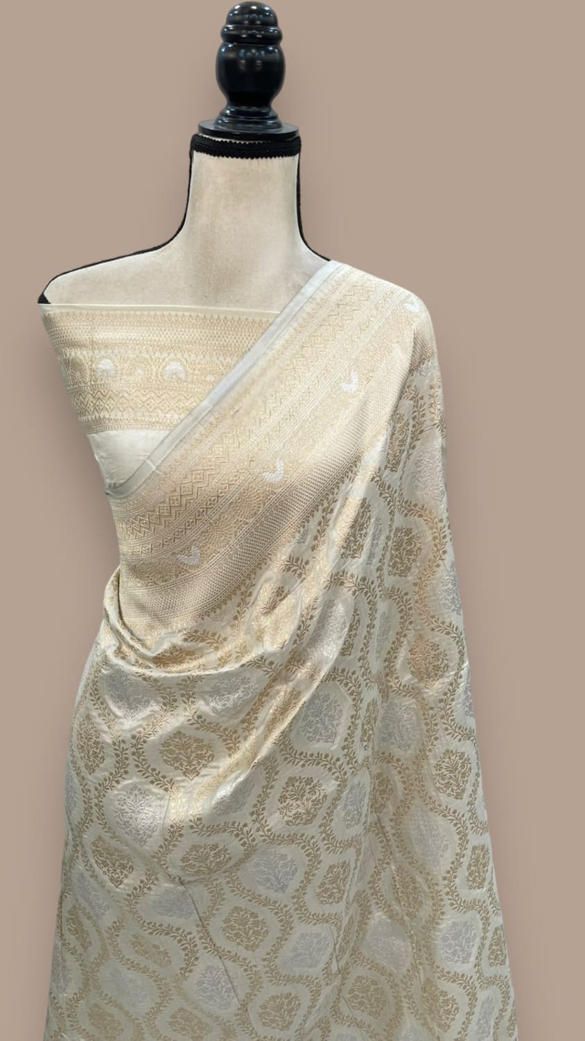 Off-white Banarasi silk saree with woven jaal pattern and zari border