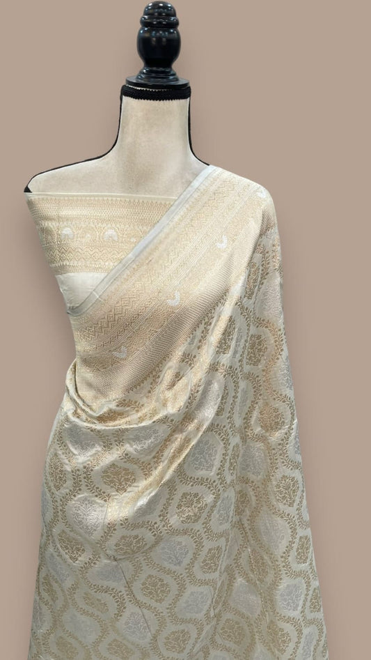Off-white Banarasi silk saree with woven jaal pattern and zari border