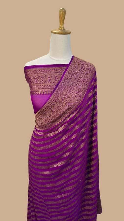 Purple silk Banarasi saree on mannequin with woven border and striped pattern