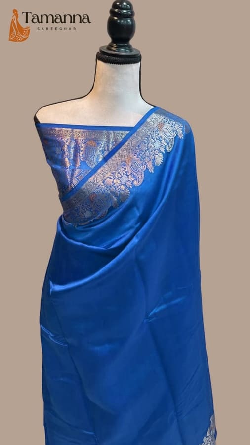 Blue silk saree with ornate gold-toned border and patterned pallu