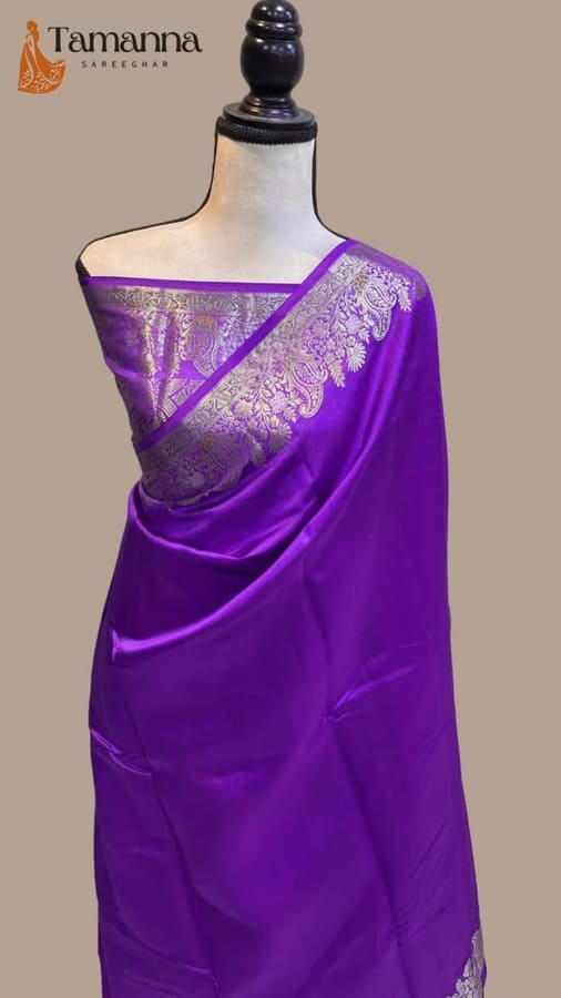 Purple silk saree with zari border and pallu drape on mannequin