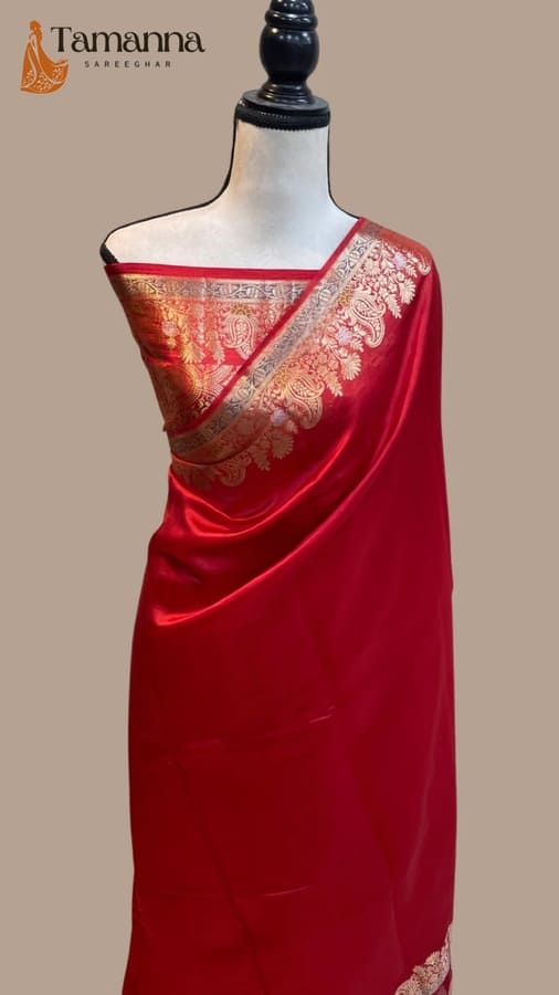 Red silk katan saree on mannequin with gold-toned Banarasi-style border and pallu