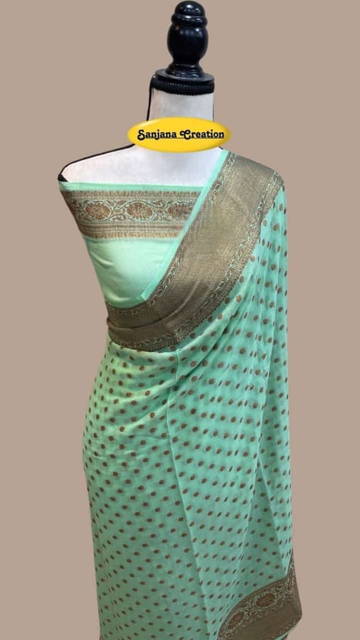 Teal baby chiffon Banarasi saree with bronze-gold woven border and dotted motifs