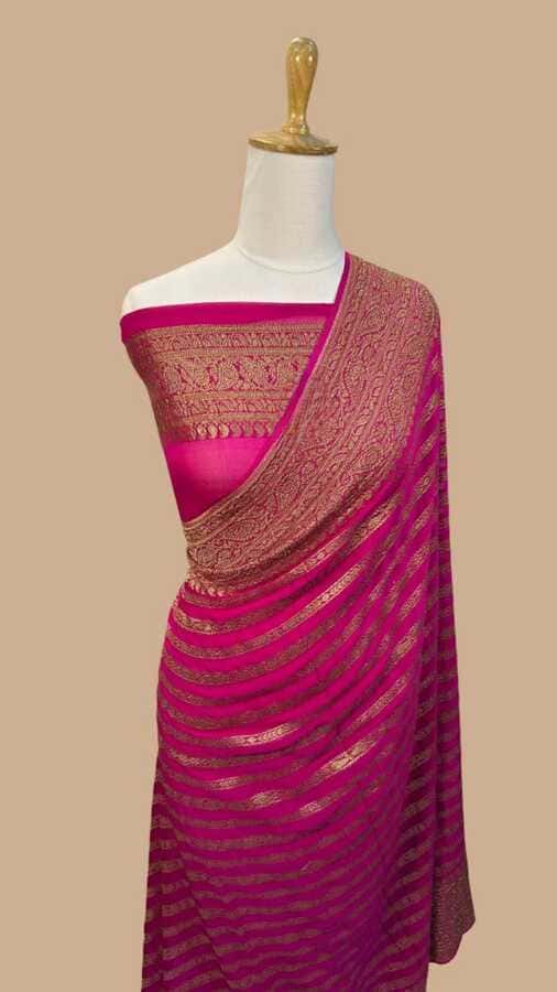 Hot pink silk Banarasi saree with gold border and woven striped body