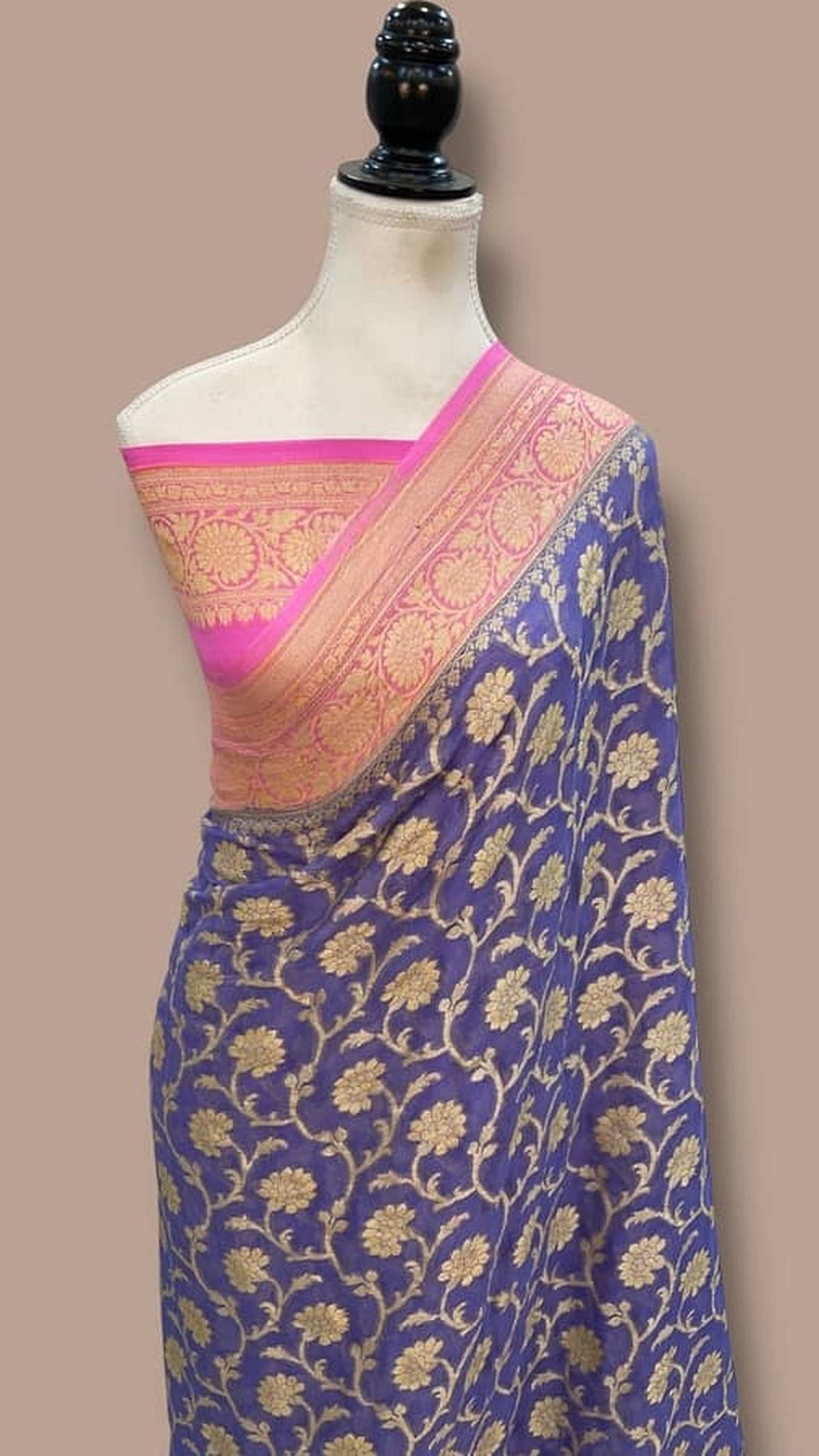Blue Banarasi chiffon saree with gold motifs, pink border pallu draped on mannequin