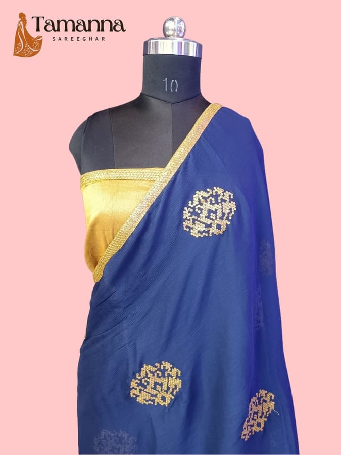 Royal blue chiffon saree with gold zari border and gold sitara motifs