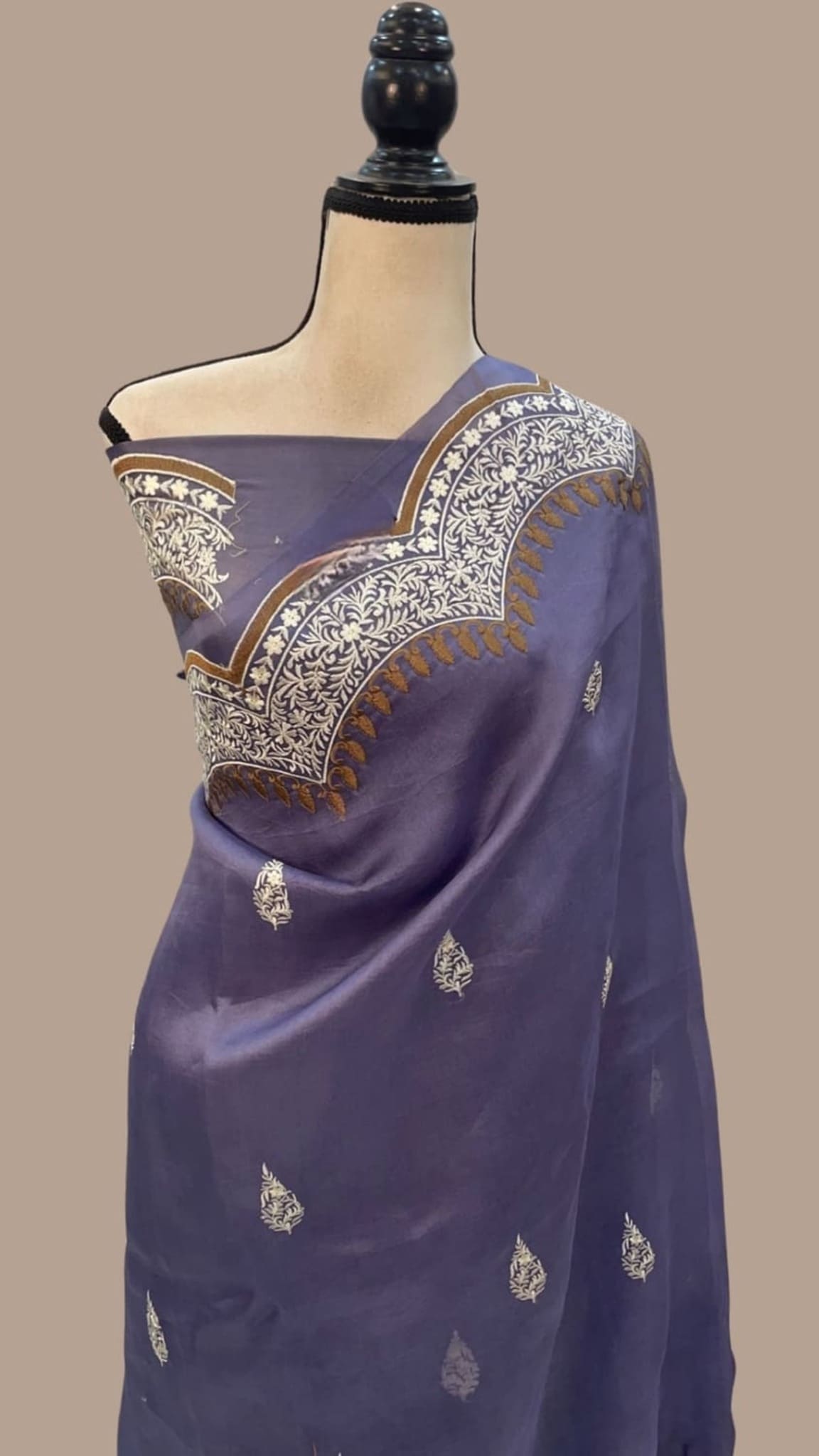 Dark blue pallu saree with gold leaf motifs and embroidered zari edge
