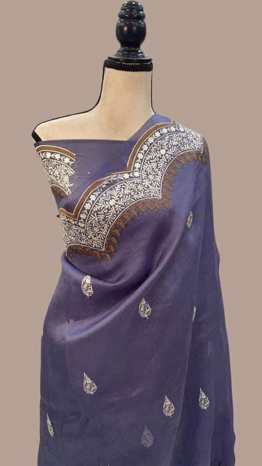 Dark blue pallu saree with gold leaf motifs and embroidered zari edge