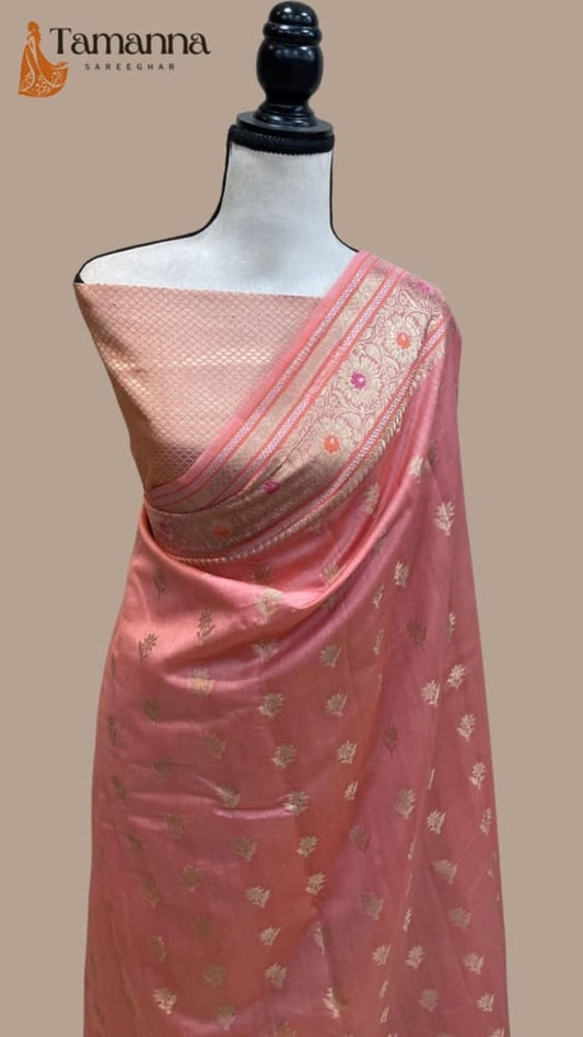 Draped pink Banarasi saree on mannequin with shiny finish, cream border, patterned pallu