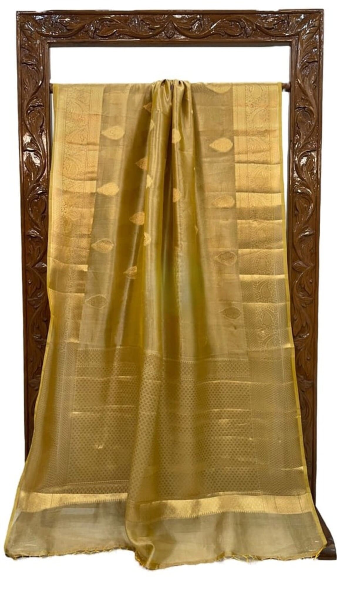 Golden yellow Banarasi tissue saree, draped and folded, with woven check and dot motifs