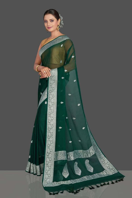 Green georgette saree with sheer body, silver lattice border, teardrop motifs and fringe