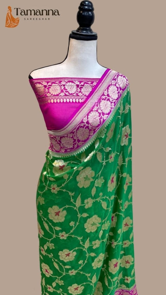 Draped Banarasi saree with green body, magenta pallu, and gold floral border