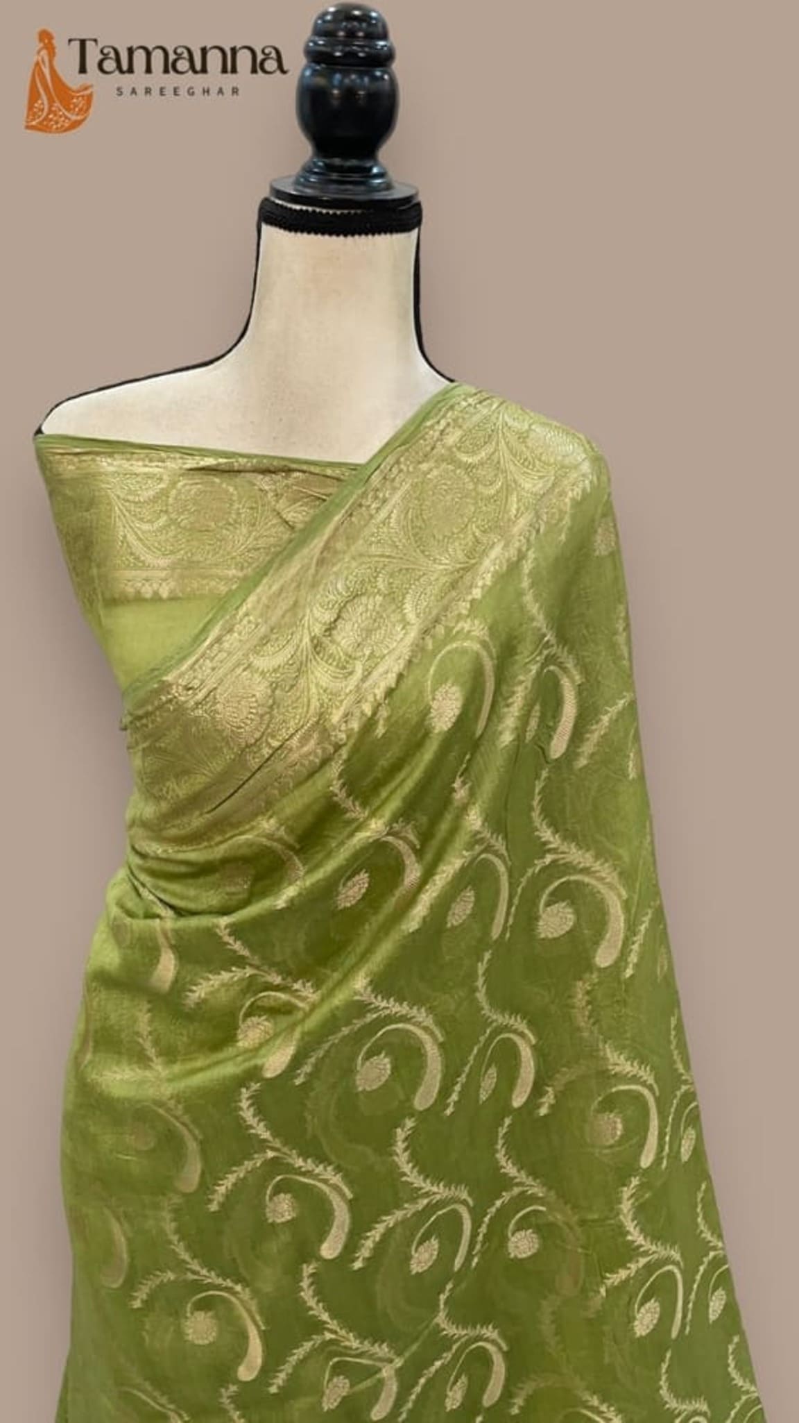 Green handloom Banarasi saree in pure cotton, gold motif pallu draped on mannequin