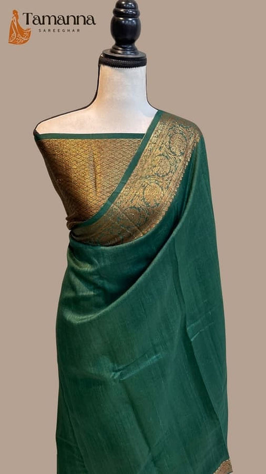 Green silk saree with gold embellished pallu and ornate woven border details