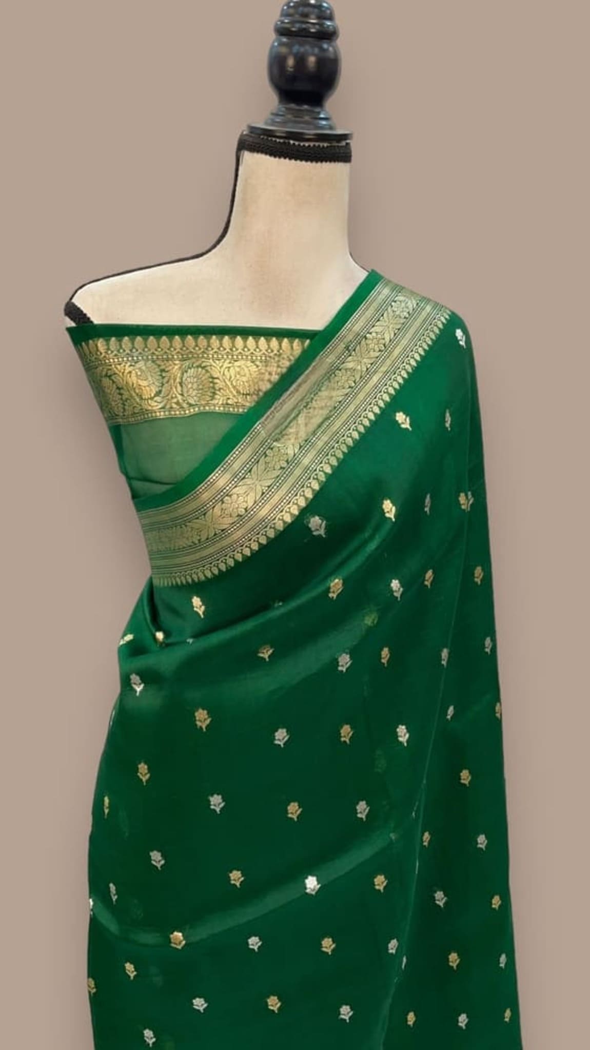 Green Banarasi-style handloom saree with gold border and small dot motifs