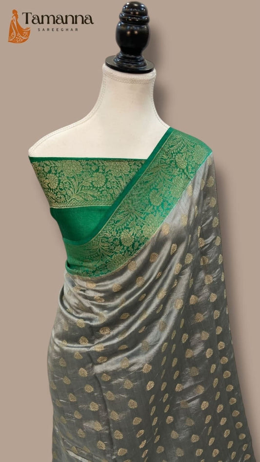 Grey silk saree with gold dot motifs and green pallu panel