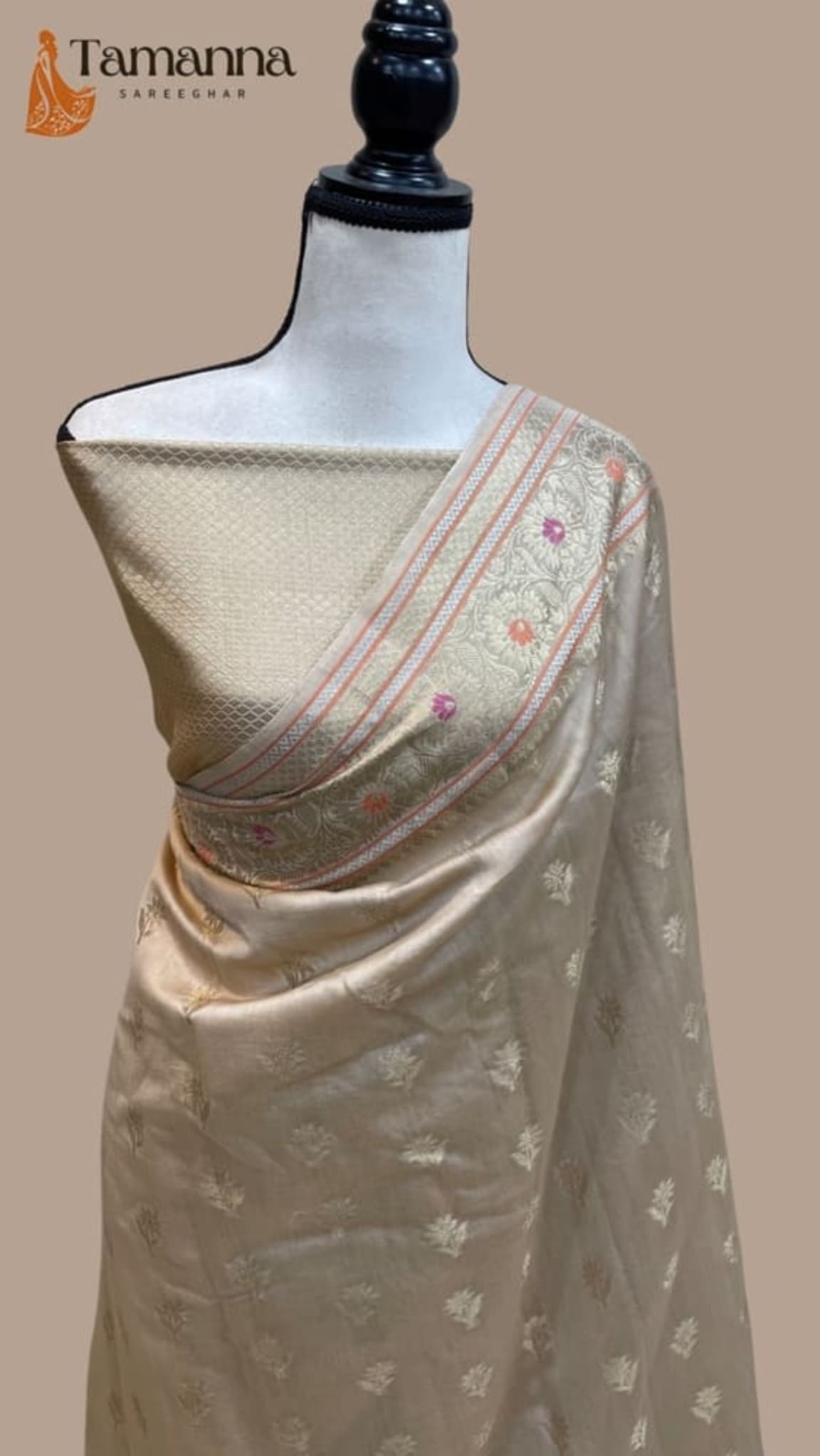 Banarasi cotton handloom saree on mannequin, shimmering gold-toned body and pink embellished pallu