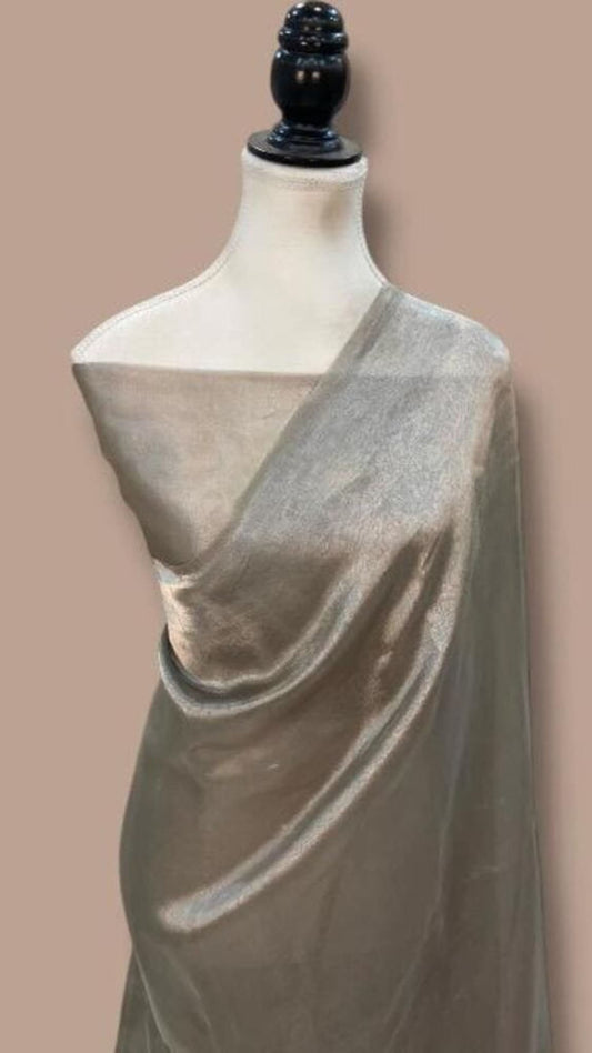 Grey handloom Banarasi saree draped on a mannequin with plain pallu