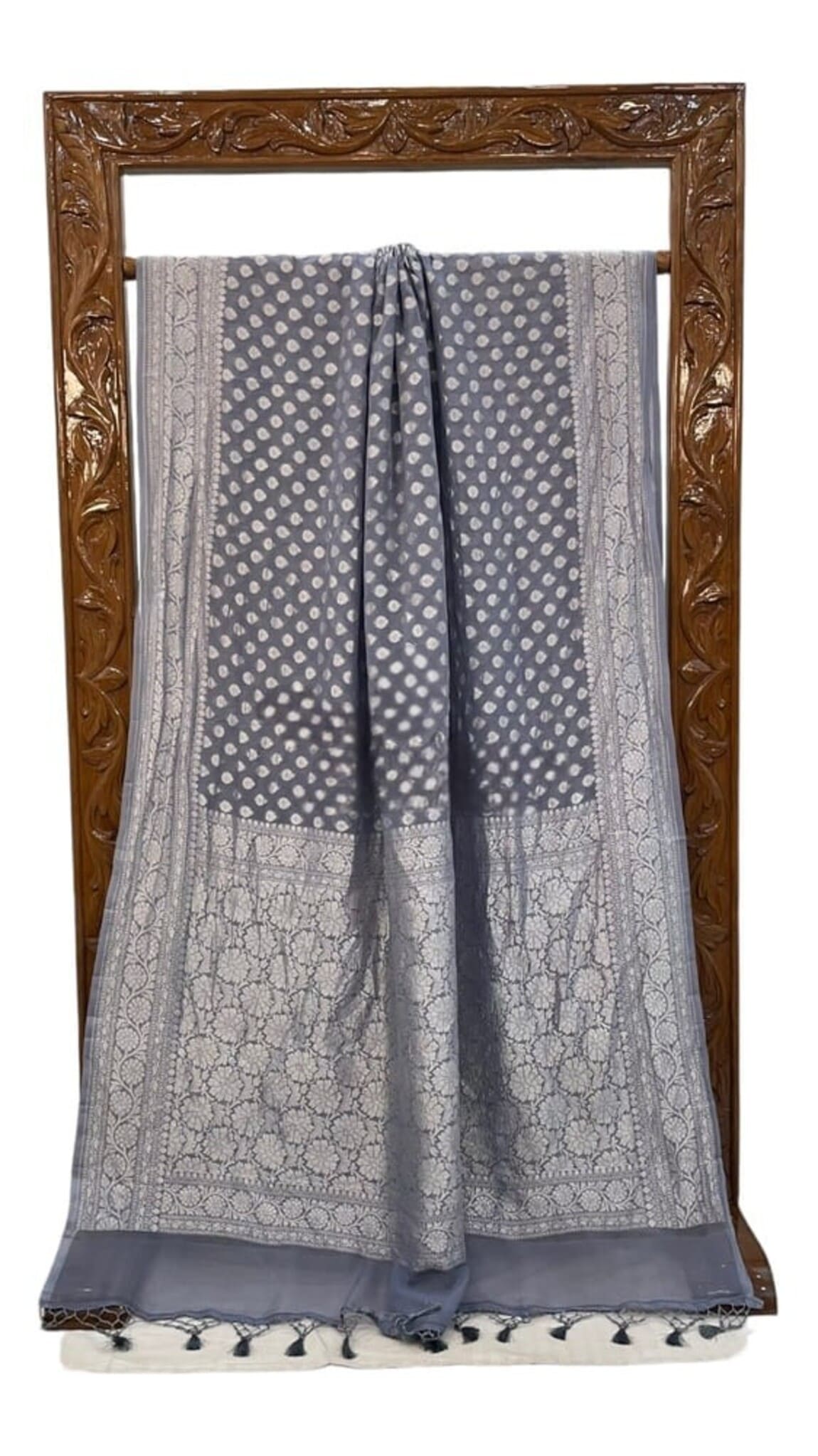 Blue and grey saree with dotted body, ornate silver border, tassel trim
