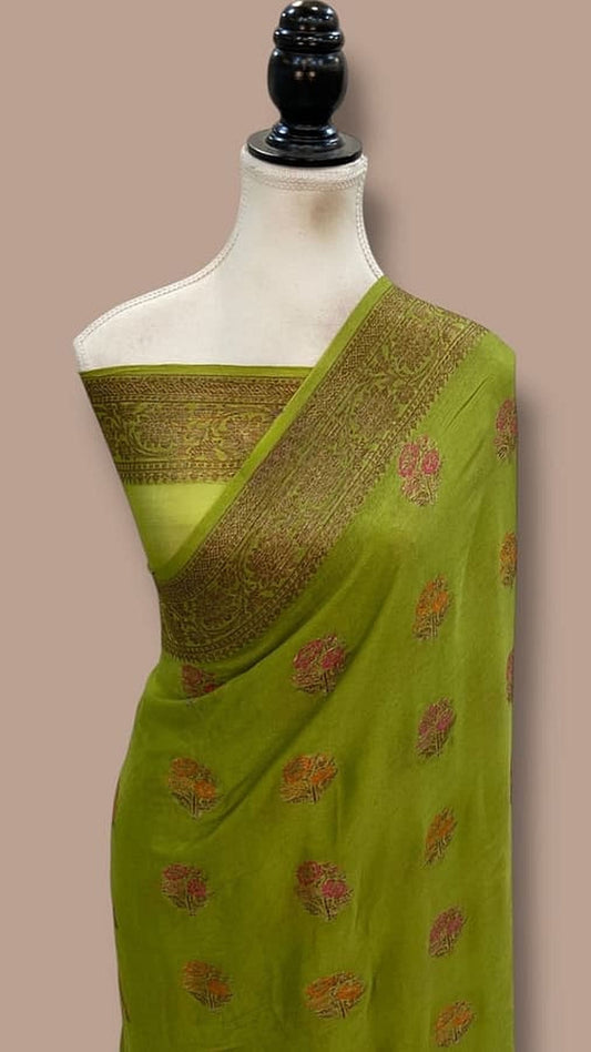 Lime green saree with gold pallu border and small pink floral motifs