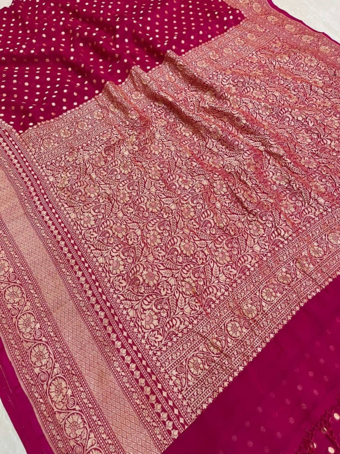 Hot pink pallu detail with ornate gold zari design and contrast fabric border trim