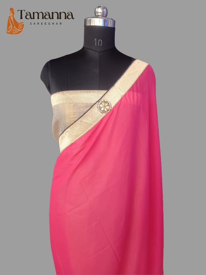Hot pink chiffon saree with beige-gold pallu border and decorative motif