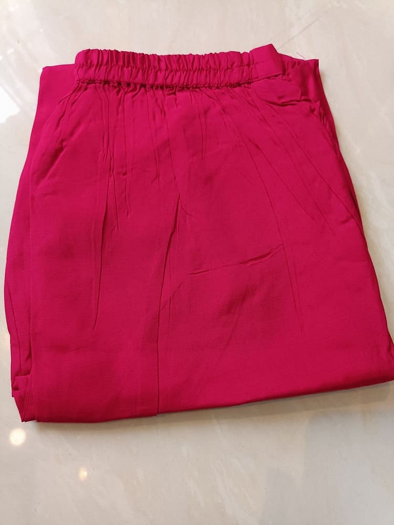 Hot pink silk pants with elastic waist and straight fit pleats