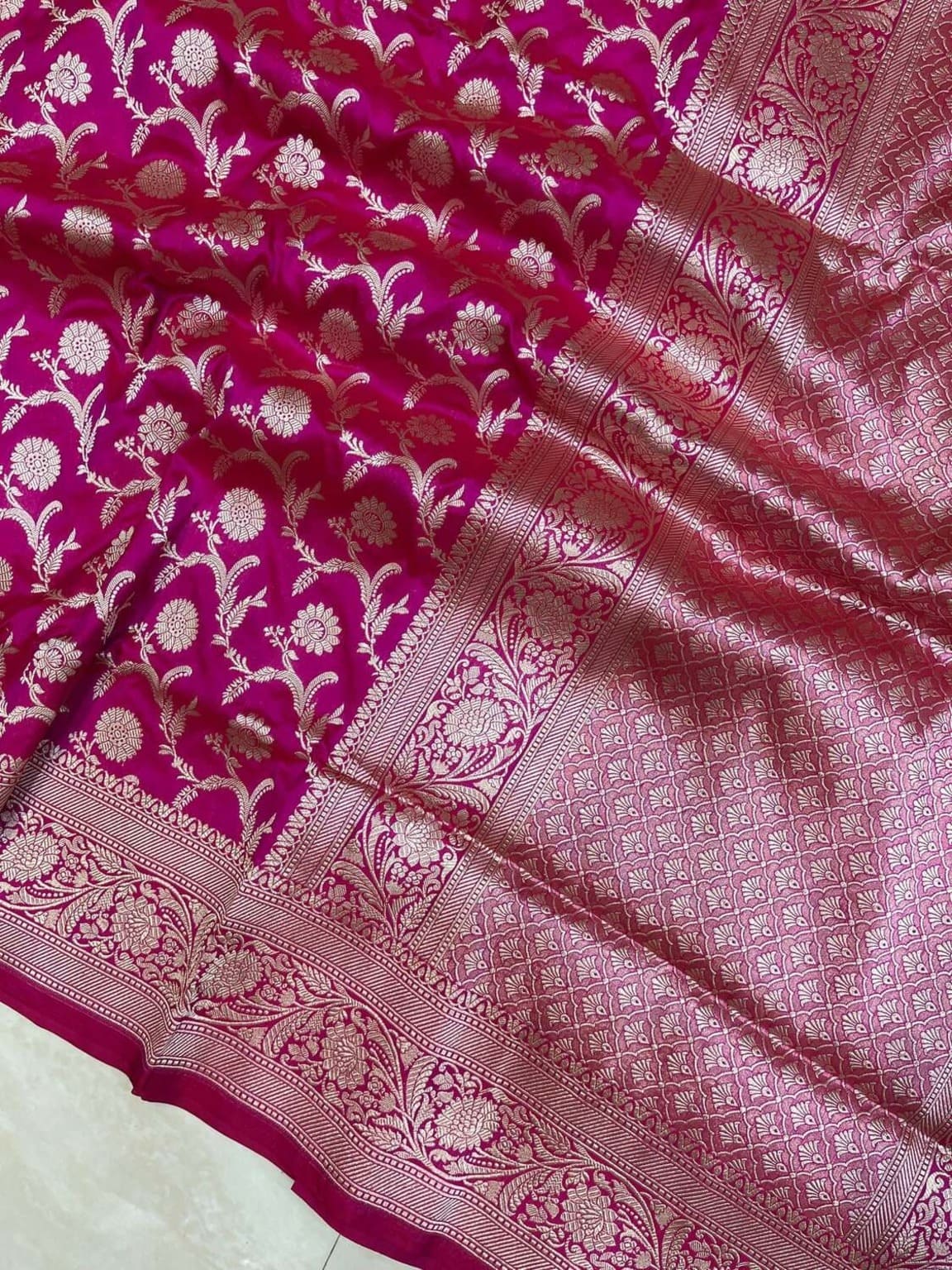 Hot pink silk saree border panel with floral jaal motifs and woven geometric design