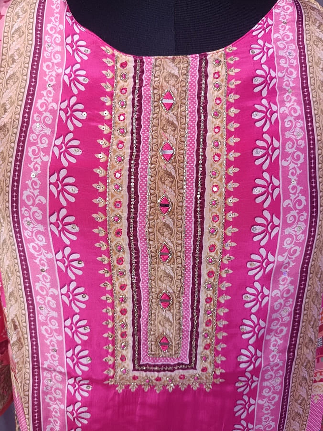 Hot pink kurta front panel with vertical gold trim and small multicolor motifs