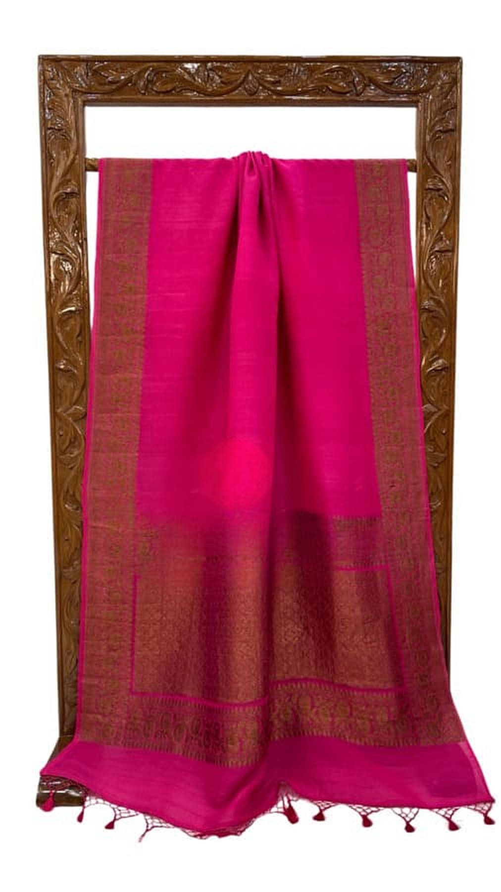 Hot pink saree folded with gold-toned pallu border and hanging tassels