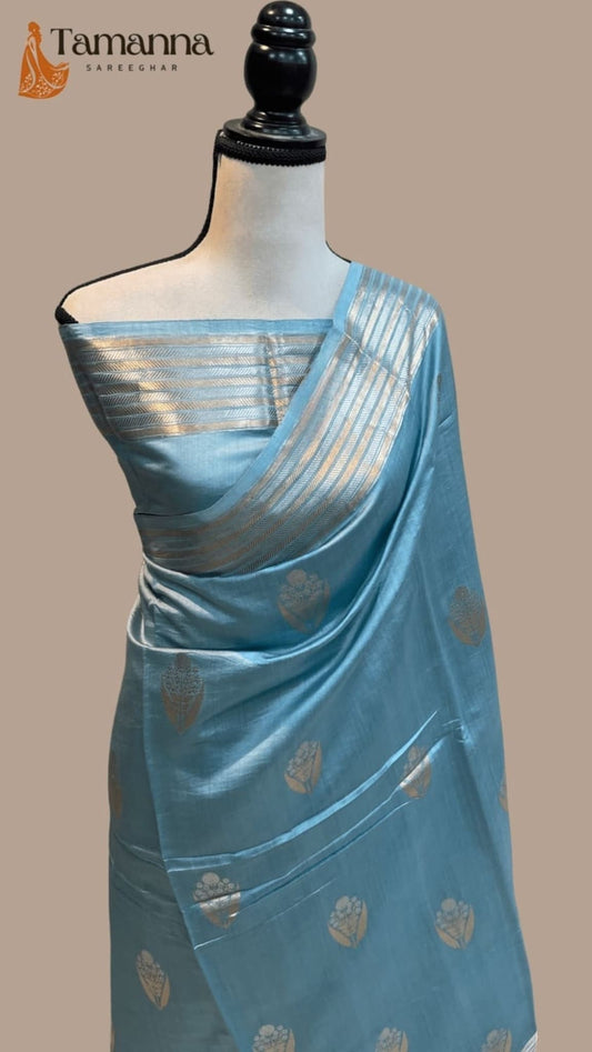 Ice blue silk drape with gold leaf motifs and shimmering striped border