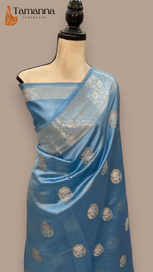 Ice blue silk saree with zari-embroidered pallu and scattered gold motifs