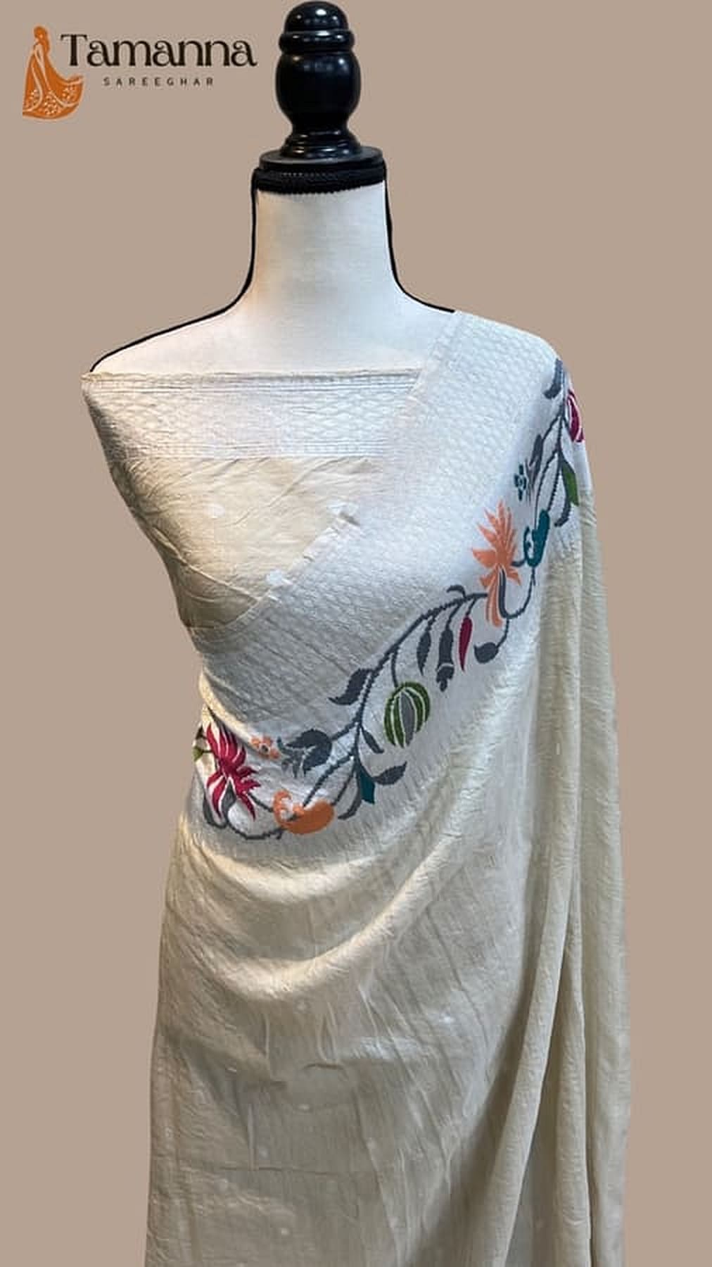 Ivory georgette handloom saree with multicolor floral border and pleated drape