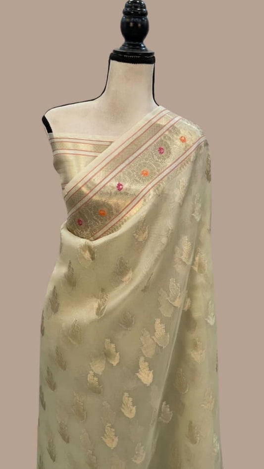 Ivory Banarasi saree with gold-tone weave, multicolor motif border and pallu
