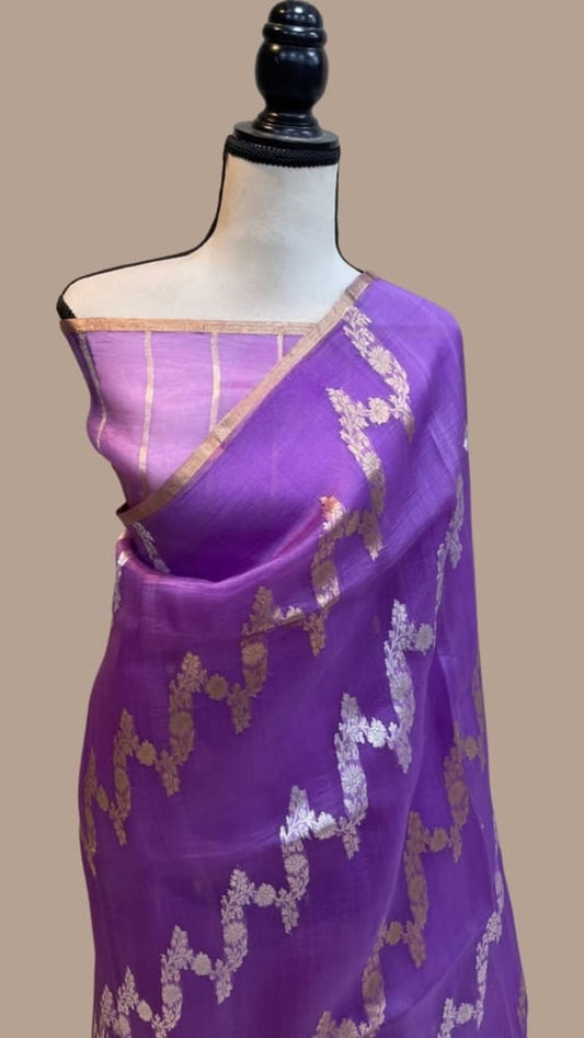 Lavender purple saree with gold zari border and floral motifs on mannequin