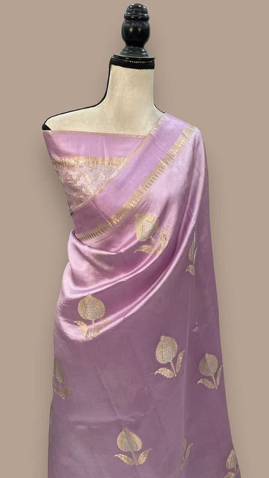 Lavender silk saree on mannequin with gold leaf motifs and gold trim