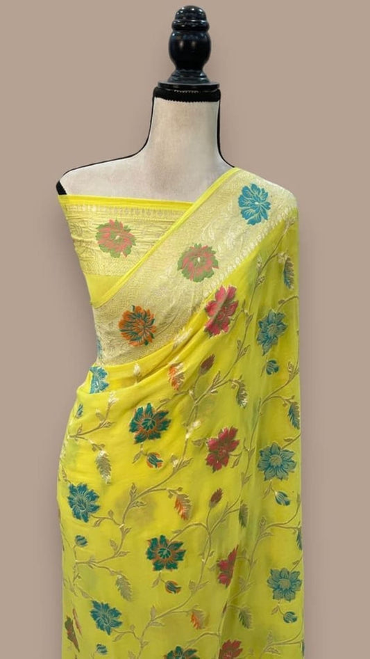 Lemon yellow saree pallu with multicolor floral motifs and contrast teal border on mannequin