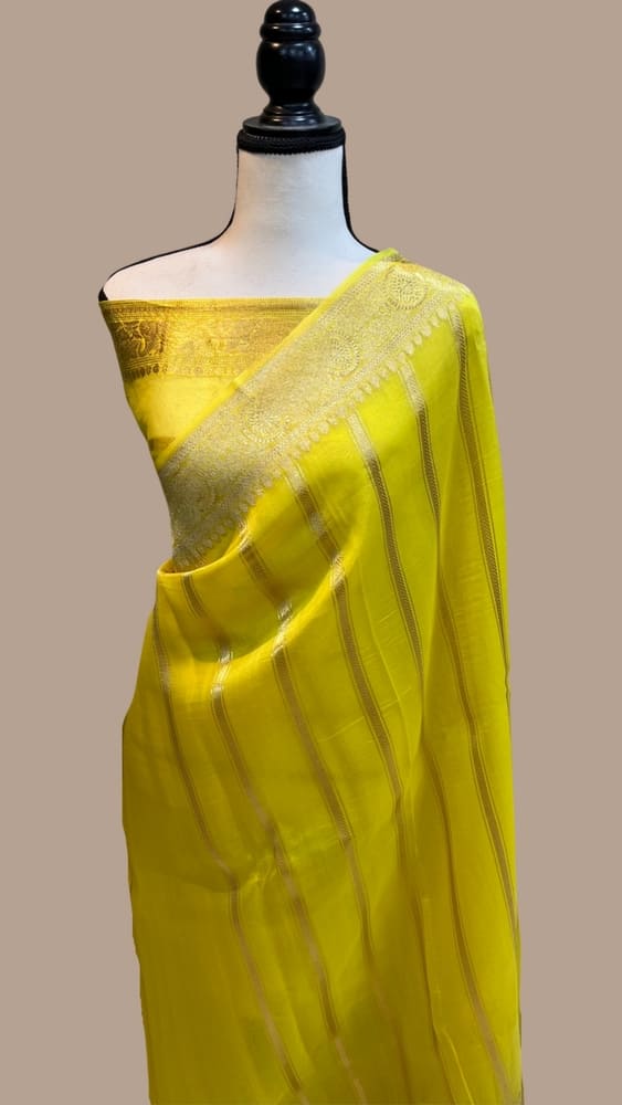 Lemon yellow Banarasi handloom saree with gold zari striped border