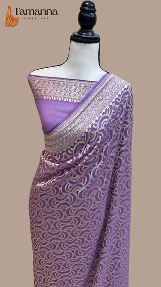 Purple Banarasi handloom saree draped on mannequin, patterned gold pallu border