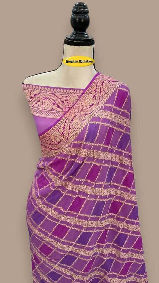 Light purple Banarasi chiffon saree with diagonal gold bands and pink pallu border