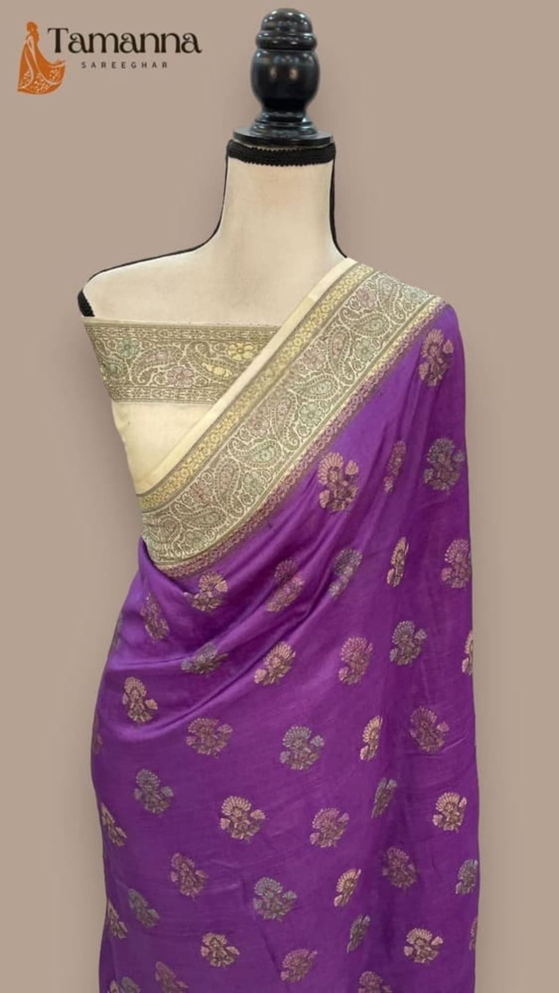 Purple crepe saree with gold buti motifs and broad gold zari border, draped