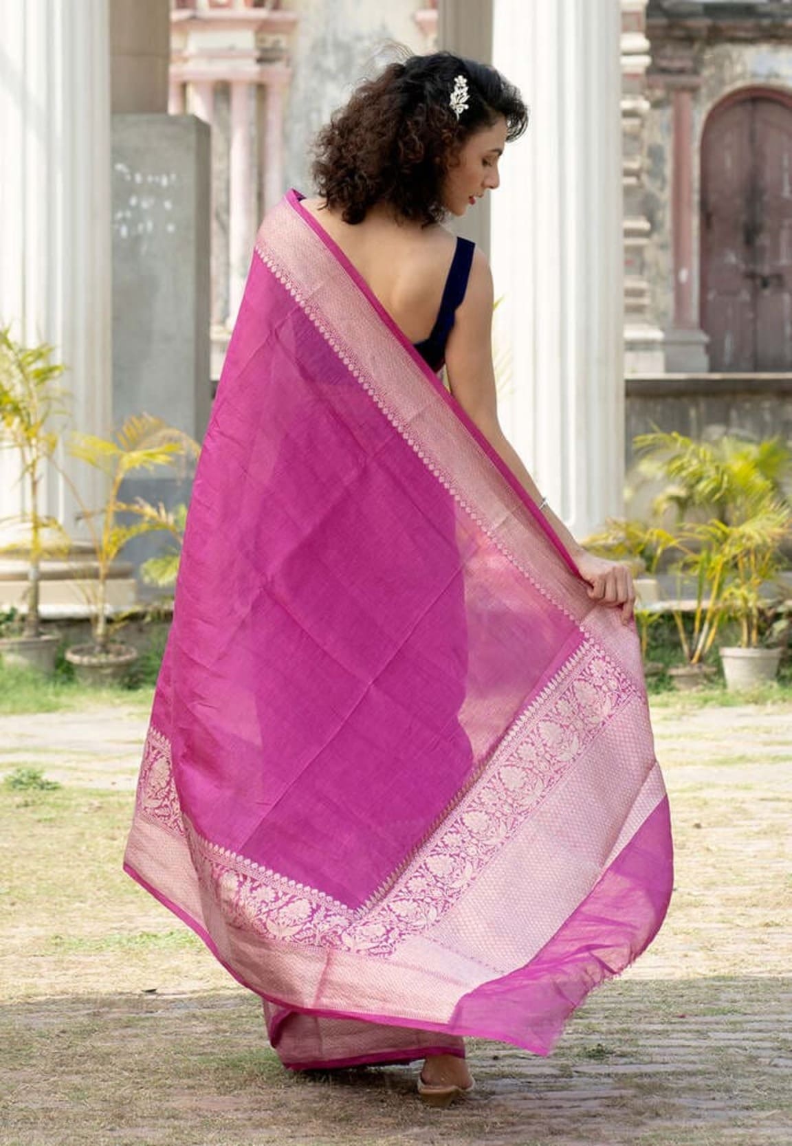 Magenta linen saree with embroidered pallu border and sheer light pink-beige inner panel