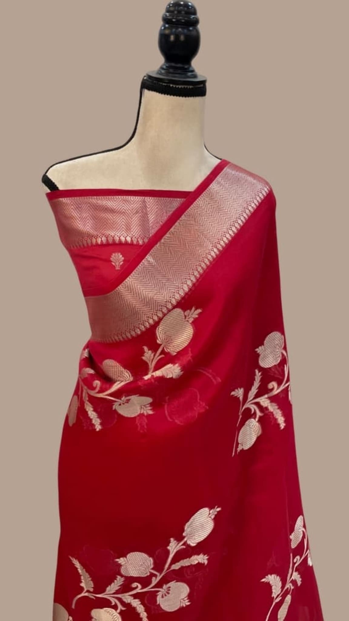 Red saree with zari-style woven kora border and off-white floral vine pattern