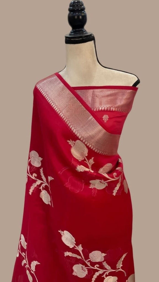 Magenta saree with silver-gold kora border and off-white floral butta on drape