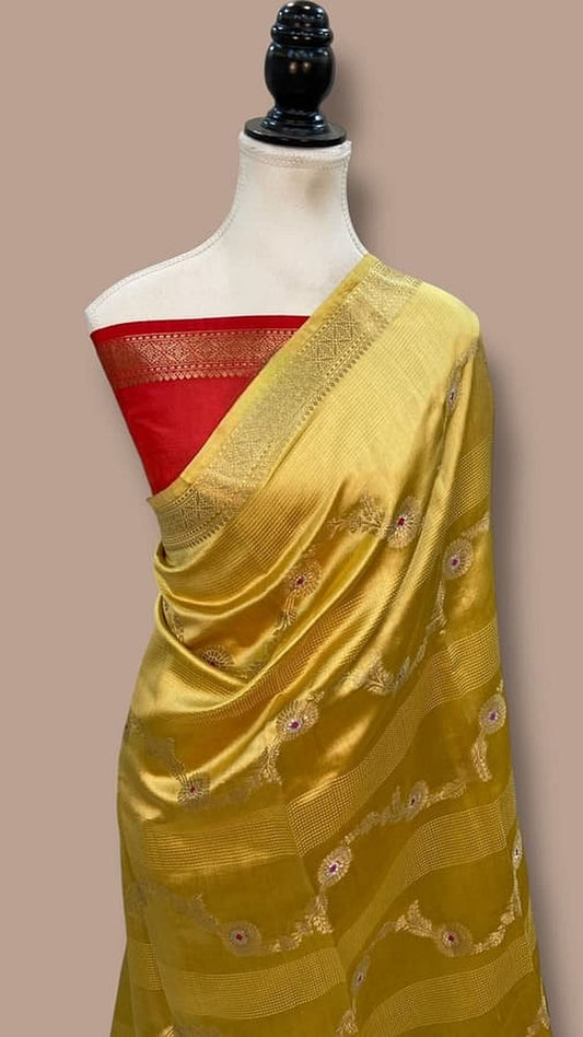 Mango silk Banarasi saree with red blouse section and pallu border with small motifs