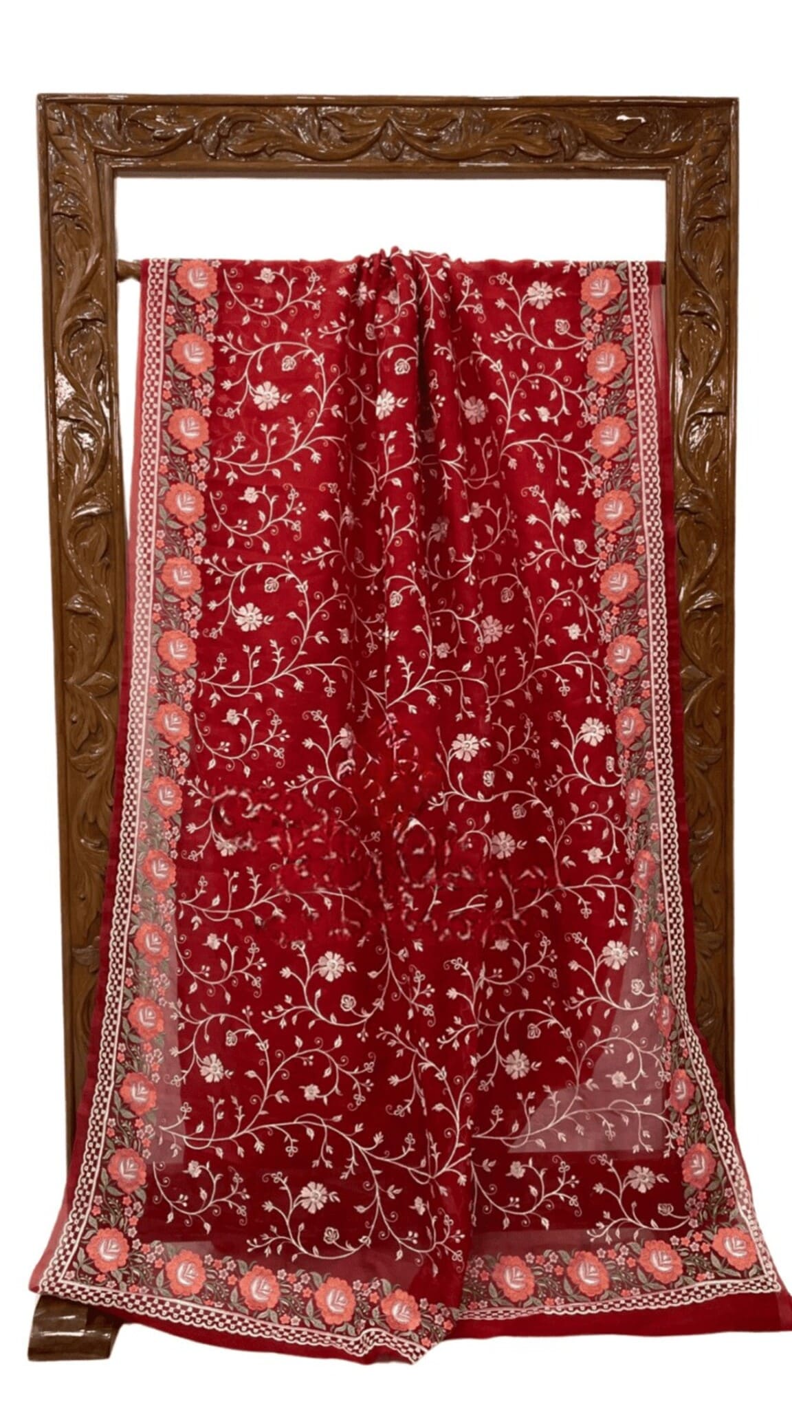 Maroon saree laid flat with floral jaal motifs and patterned border, corner medallions