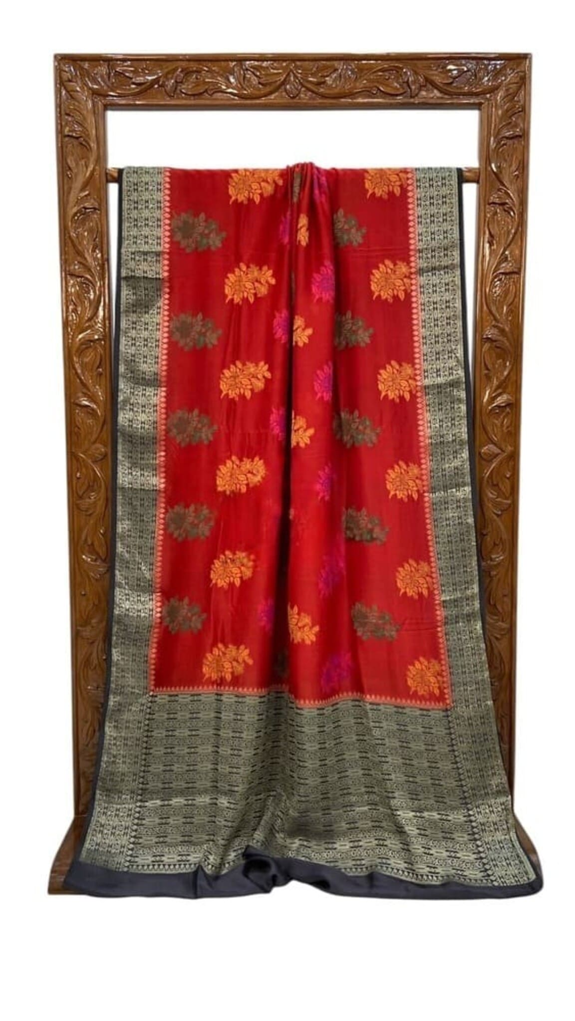 Red Banarasi saree folded on frame with black border and gold floral motifs