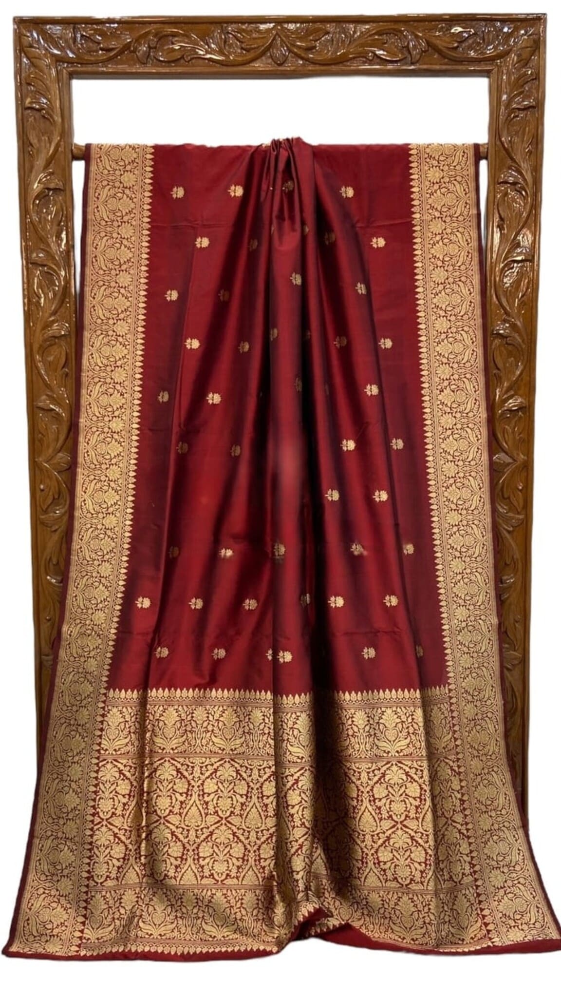 Maroon silk saree with gold border panels and pleated center, pallu with motifs