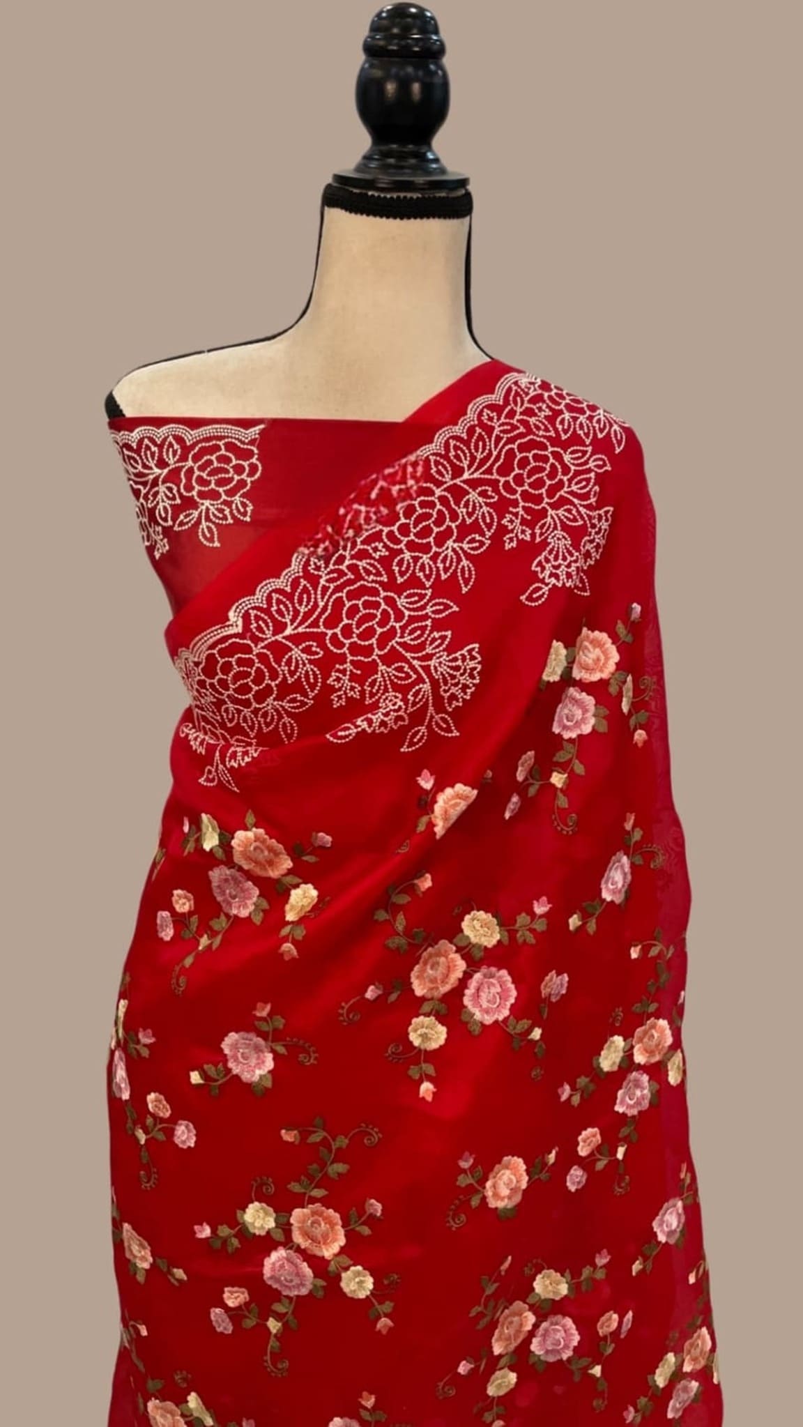 Maroon organza saree with dense floral motifs and gold-toned border pallu